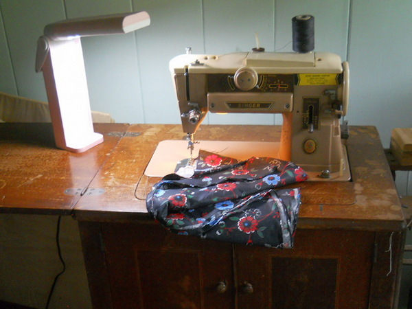 black floral cloth being sewn on the 401a Sewing machine