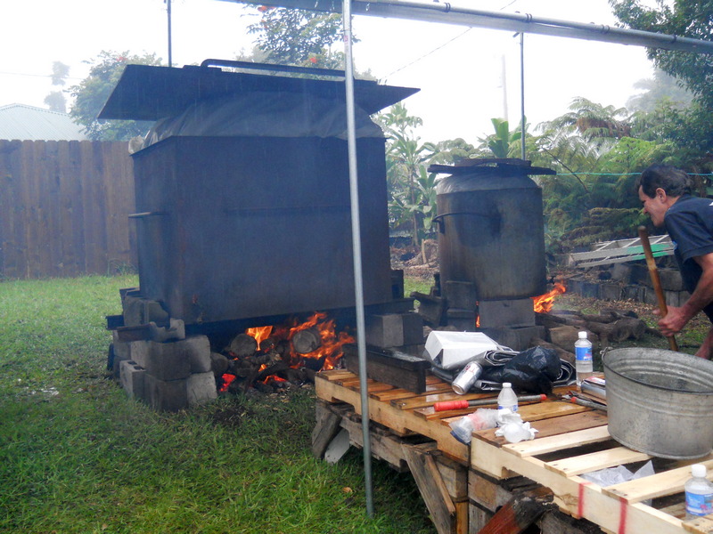 two huge steamers with bonfires under them