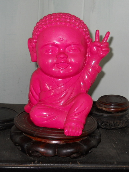 Hot Pink baby Buddha statue back upright