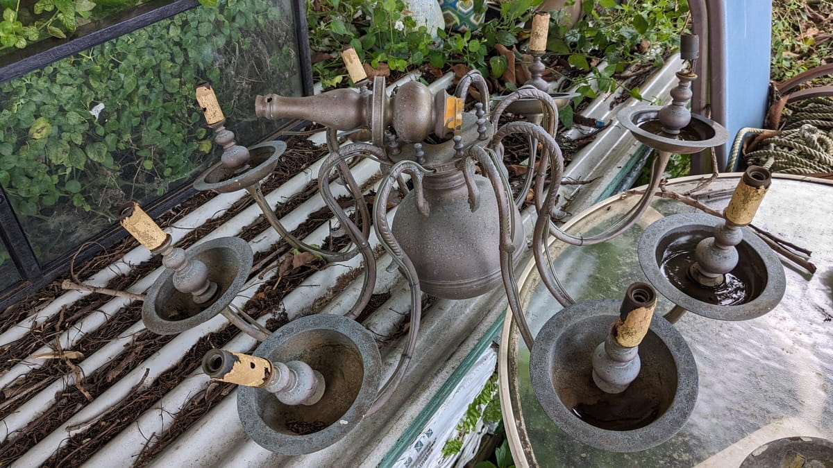 brass chandelier in parts and in need of repairs 