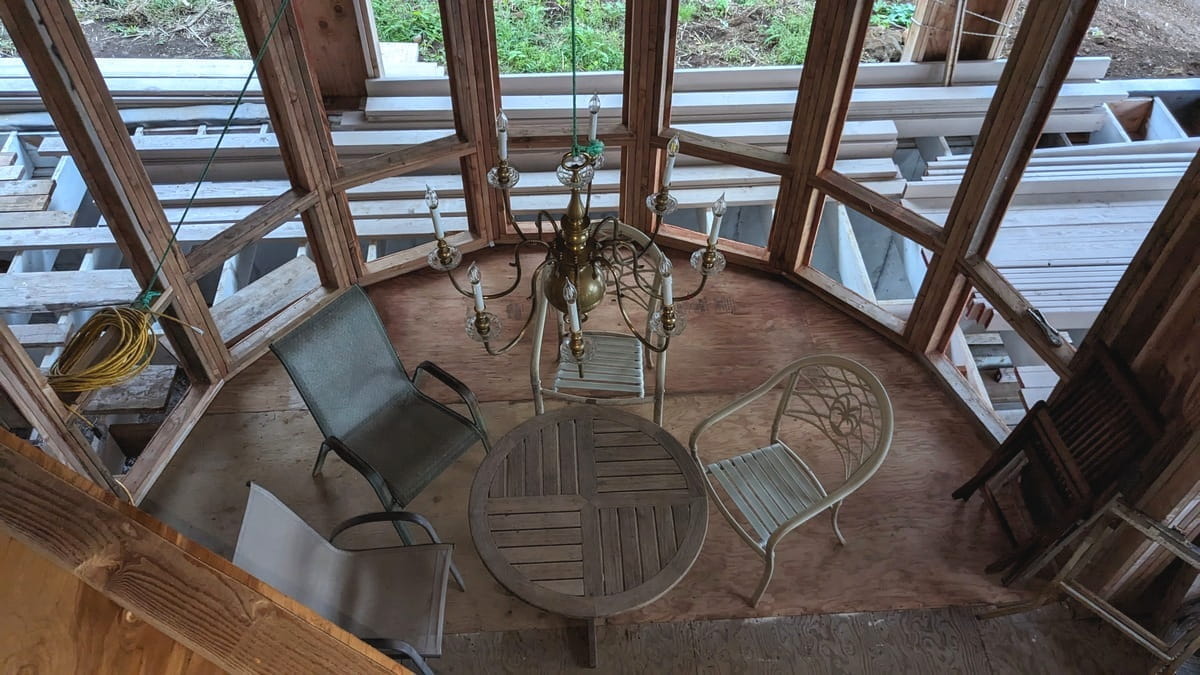 looking down into dining area with chandelier
