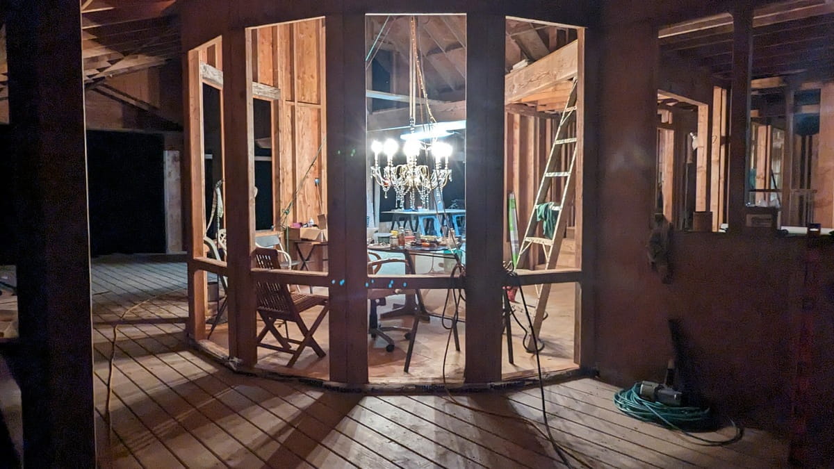 view of dining area from outside with lit up chandelier